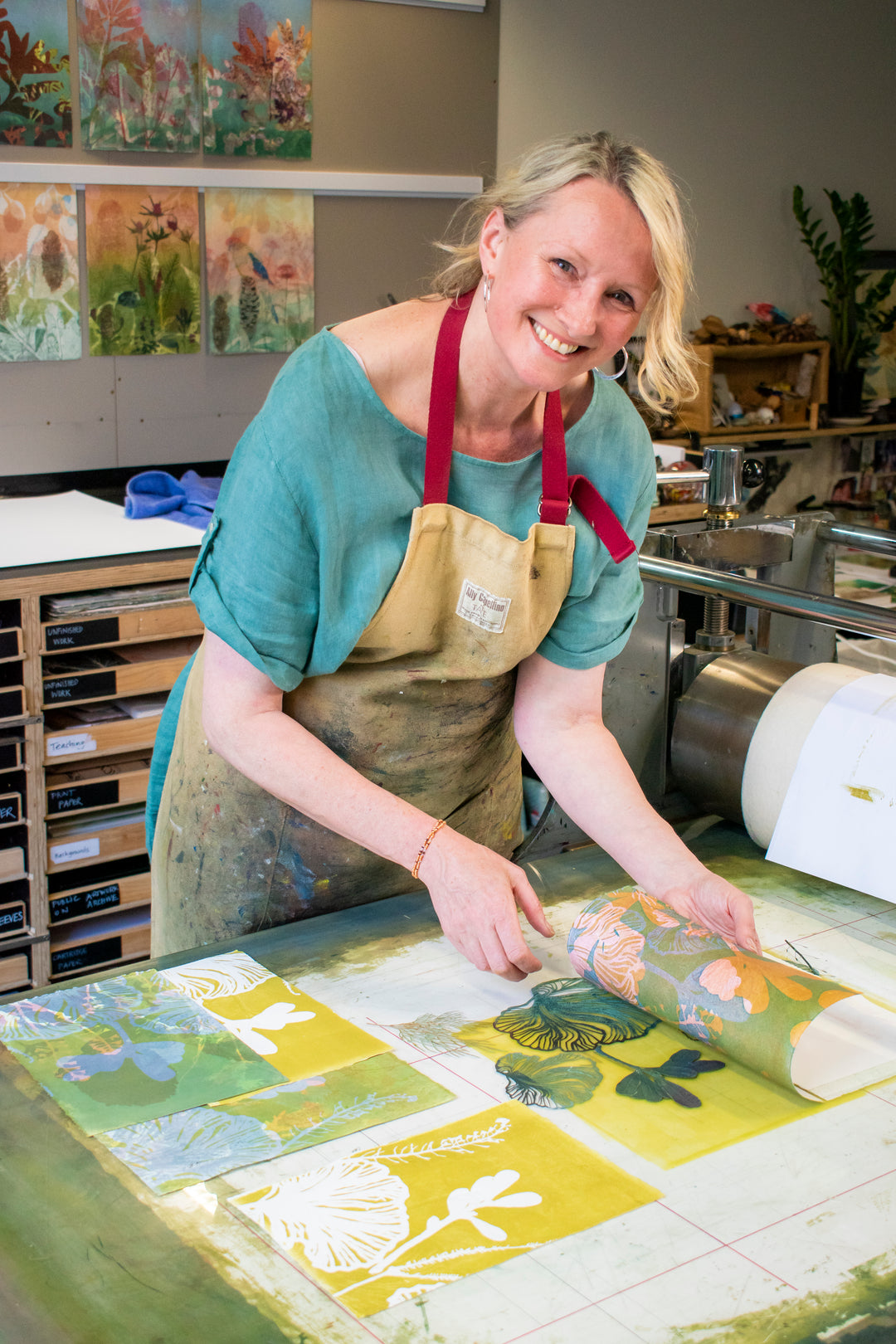 Australian Artist Trudy Rice with her printing press in the studio